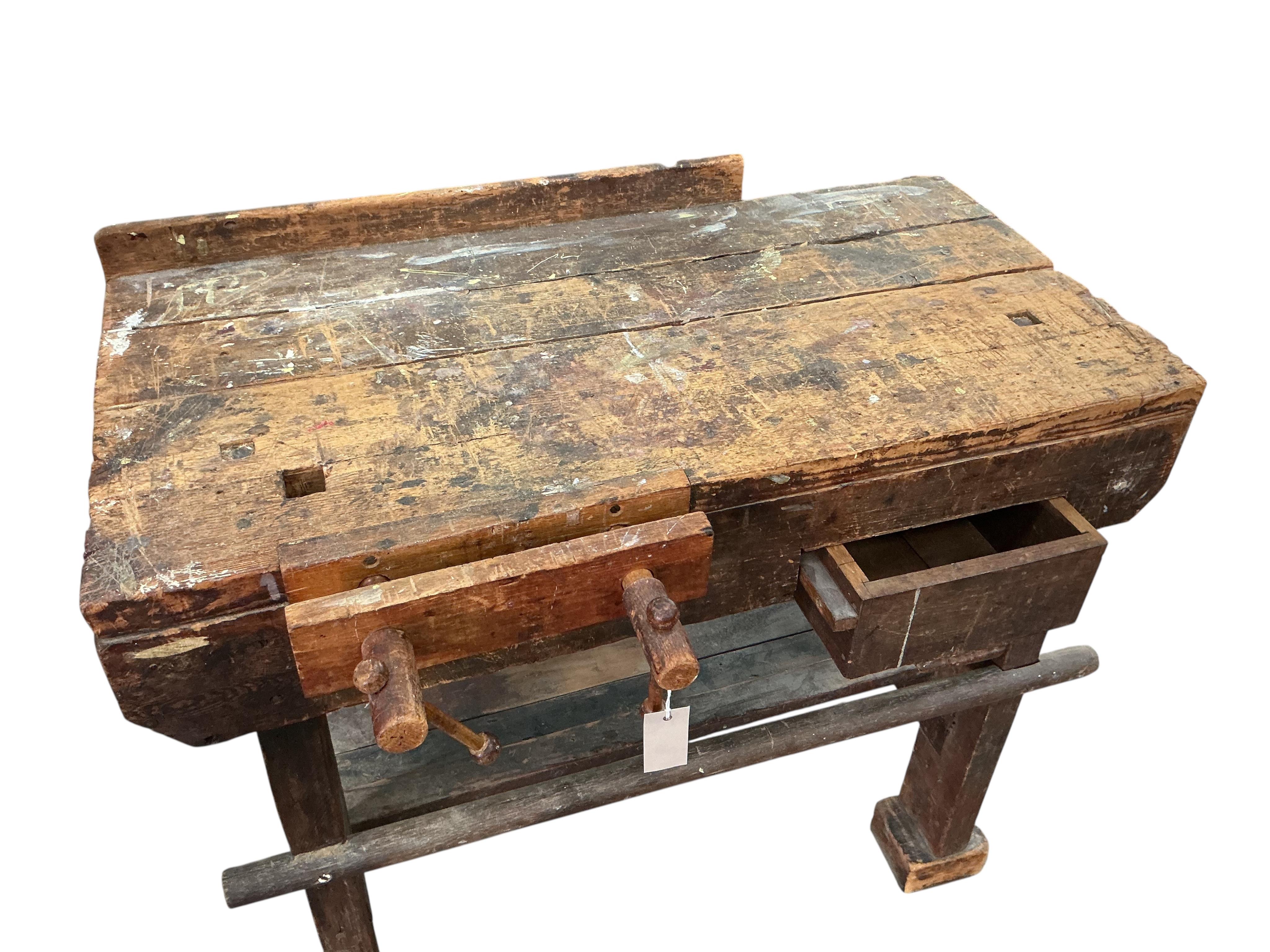 A small Provincial pine work bench with vice, width 92cm, depth 46cm, height 77cm